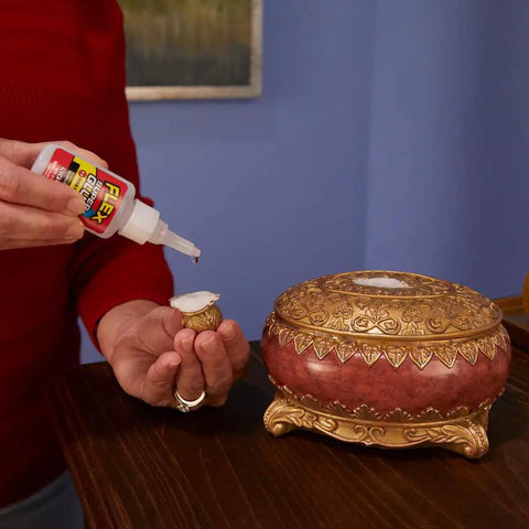 Using Crystal Clear Super Glue Instant Bond Adhesive Hella Tough 20 Gram Bottle to repair decorative container.