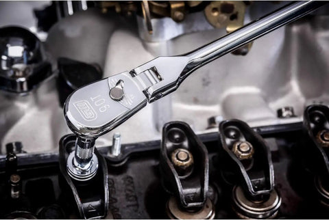 Half Inch Drive 90-Tooth Teardrop Ratchet with Cushion Grip Flexible Head loosening bolt on engine block