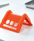 Orange 20 Pack Plastic Flatbed Edge And Corner Protectors for trucks, showcasing side view on table with tools.