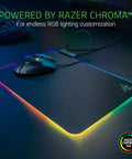 Hard RGB Gaming Mouse Pad V2 With Customizable Chroma Lighting and Built In Cable Management, non-slip base, on gaming desk.