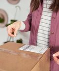 Person sealing a box with Heavy Duty Clear Packing Tape Refills, 6 Rolls, Strong Adhesion For Shipping, Moving And Storage, Transparent Packaging