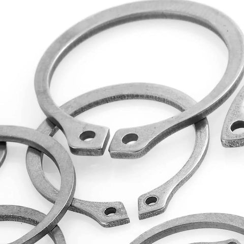 External Retaining Ring Nine Sixteenths Inch Stainless Steel Pack Of 100 For Shafts 0.562 Inch Diameter Precision Groove Fit Auto Industry Quality Snap Ring close-up