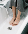 No Fuss Solid Stainless Steel Bathtub Drain Strainer And Hair Catcher Filter Basket For Bathroom Sink Drain Plug in use in a bathtub.