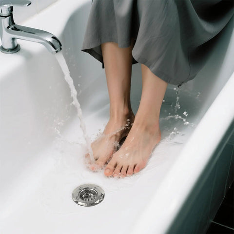No Fuss Solid Stainless Steel Bathtub Drain Strainer And Hair Catcher Filter Basket For Bathroom Sink Drain Plug in use in a bathtub.