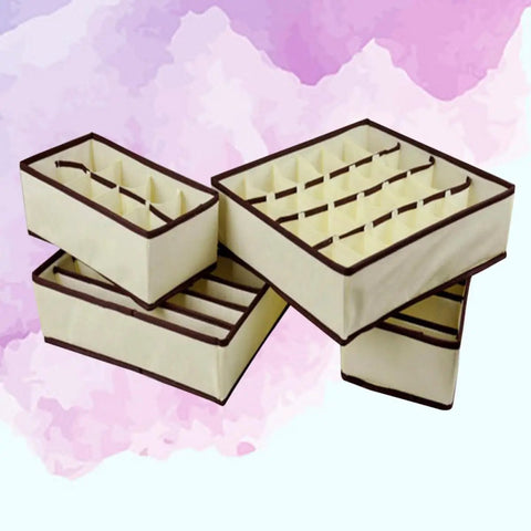 4-Pack Non-Woven Bra Storage Boxes To Sort Your Drawer Drama And Keep Socks Ties Scarves Intact While Absorbing Moisture And Odor So Your Lingerie Game Stays Strong And Your Closet Always Looks Fresh, beige bins with compartments.