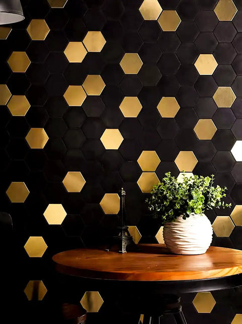Peel And Stick Backsplash Honeycomb Tile Set For Walls Kitchen Bathroom And Fireplace Stainless Steel Look Gold Brushed Black Finish 5 Sheets Easy Cut And Install displayed on wall behind table with plant.