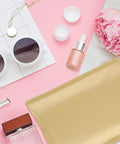Natural Kraft Bubble Mailers 6x10 Inch Self Sealing Padded Envelopes 6x9 Inner Size 100 Pack with cosmetics on pink background