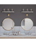 Gulliver Collection Three Light Clear Seeded Glass Coastal Bath Vanity Light in galvanized finish above dual mirrors and sinks.