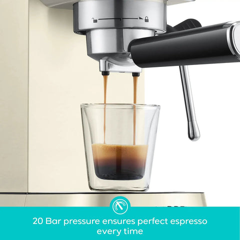 Next Level Compact Espresso Maker With High Pressure Pump And Hassle Free Milk Frother For Pulling Bold Coffee Shots And Topping Off Sweet Lattes Anytime, espresso being brewed into a clear glass shot.