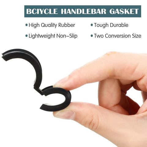 Hand holding a rubber shim from 12 Pack Bike Handlebar Shim Gaskets Spacers 22.2/25.4 Mm To 31.8 Mm Non Slip Rubber Adapters