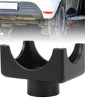 Bottle Jack Axle Adapter Lifting Saddle for 12 Ton Jacks with black powder coat under a lifted vehicle.