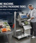 Big Time Vertical Pneumatic Vacuum Sealer With Wide 600mm Stainless Steel Sealing Bar And Rolling Cart in kitchen packaging vegetables.