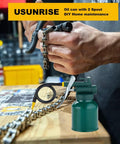Front view of green metal oil can with multiple spouts and trigger sprayer on a wooden workbench