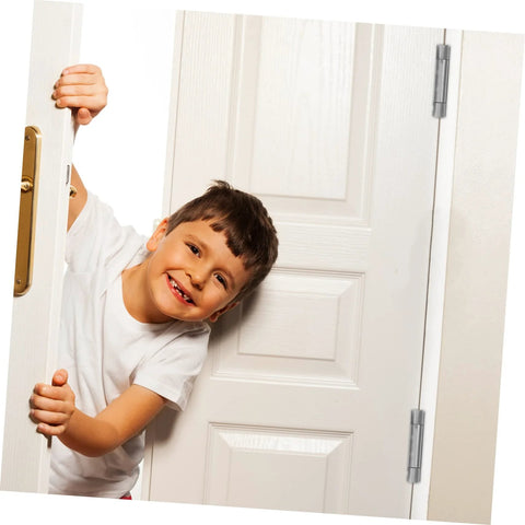 Door hinge, stainless steel, on white interior door; child peeking through doorway.
