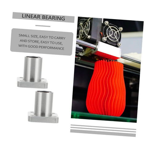Two plated flange linear bearings (front view) with a red 3D-printed vase on a printer.