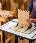 Person using Box Joint Router Jig With Precision Indexing For Router Table, working on smooth glide sled with wooden panel.