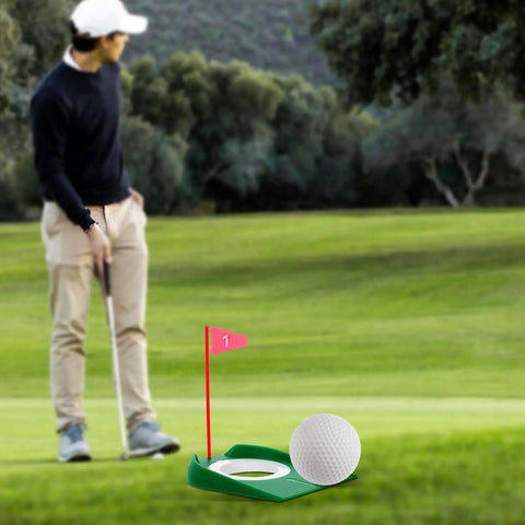 Six Pack Golf Putting Cups With Flags, Plastic Mini Golf Hole Practice Aids For Adults on grass with golfer in background