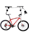 Heavy Duty Ceiling Bike Hoist For Garage With 100 Lb Capacity, Quick Mount Pulley Rack For Mountain Bikes, Strong Steel Frame With Nylon Coated Hooks To Protect Your Ride. Ceiling-mounted bike hoist holding a mountain bike with steel pulleys and nylon rope.