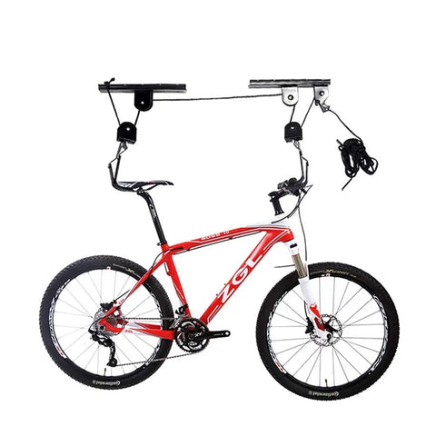 Heavy Duty Ceiling Bike Hoist For Garage With 100 Lb Capacity, Quick Mount Pulley Rack For Mountain Bikes, Strong Steel Frame With Nylon Coated Hooks To Protect Your Ride. Ceiling-mounted bike hoist holding a mountain bike with steel pulleys and nylon rope.
