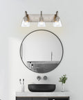 3 Light Modern Brushed Nickel Vanity Light Over Mirror Industrial Wall Sconce With Clear Glass Shades in bathroom setting