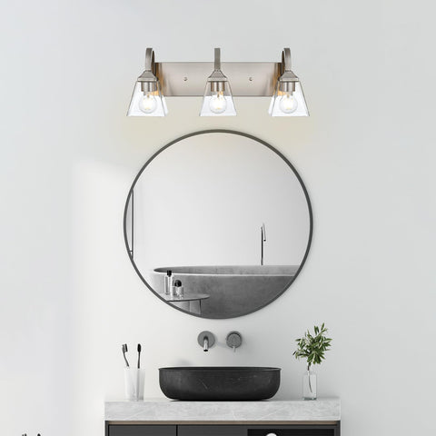 3 Light Modern Brushed Nickel Vanity Light Over Mirror Industrial Wall Sconce With Clear Glass Shades in bathroom setting