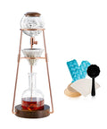 Polished Glass Cold Brew Coffee Maker Featuring Precise Drip Valve And Rugged Stainless Steel Base with ice and tools.