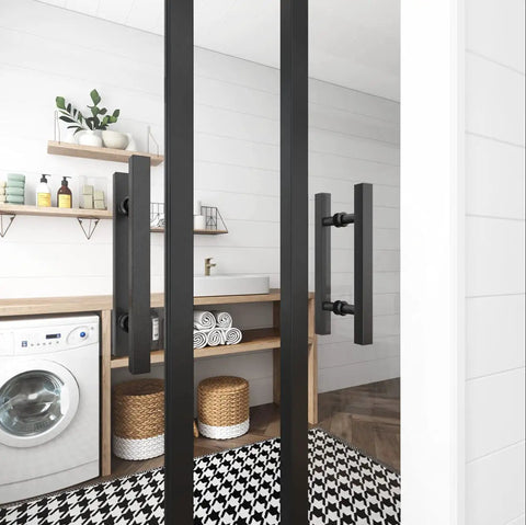 12 Inch Square H Shape Barn Door Pull Handle Dual Side Stainless Steel For Glass And Wood Doors Tough As Nails Heavy Duty Sliding Barn Door Shower Door Black Finish Pack Of 2 installed in a modern laundry room setting.