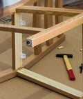 Wooden chair frame with attached rubber feet pads with screws for cutting boards and furniture non slip table and chair bumpers.