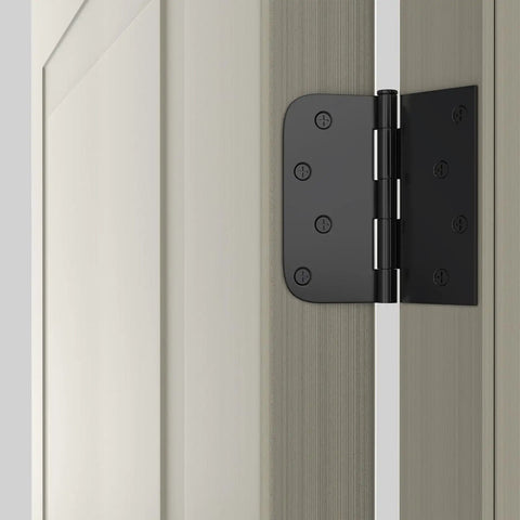 Matte Black Door Hinges 4 By 4 Inches, 12 Pack With Square And Round Corner Design attached to wooden door frame