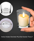 Hand holding real wax flameless votive candle with timer, 2 by 2 inch size, demonstrated with glass holder diameter measurements.