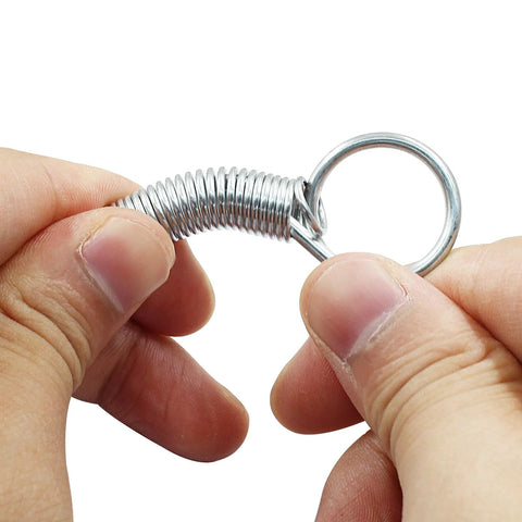 Close-up of stainless steel spring latch hook with ring for pet cage doors