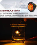 Amber Three Quarters Inch Mount LED Clearance Marker Lights Pack Of 100 for trucks submerged showing waterproof feature