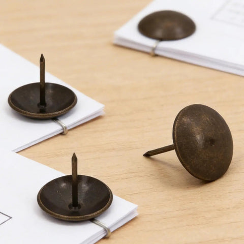 Heavy Duty Antique Brass Upholstery Tacks For Diy Furniture Repair Leather Crafting Auto Interiors Includes Thirty Solid Metal Clavos With Round Heads That Grip Tight Without Splitting Wood For A Sick Makeover Fix on a wooden surface.