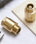 Side view of two brass 3/4 in inline check valves with male FNPT ends