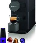 Zero Stress Single Serve Coffee Brewer With Built In Milk Frother For Rich Latte Perfection and Smooth Daily Sips Plus Sleek Black Drip Espresso Station, showcasing coffee machine and cup.