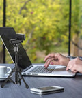 Extendable Webcam Tripod Stand For Desk Mount Ultra Sturdy Metal Frame With Non Slip Base holding camera in front of laptop