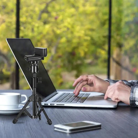 Extendable Webcam Tripod Stand For Desk Mount Ultra Sturdy Metal Frame With Non Slip Base holding camera in front of laptop