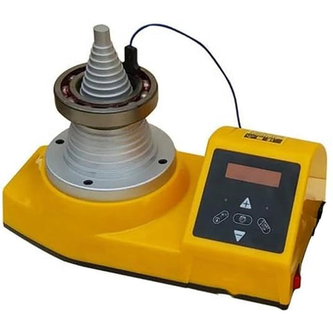 Front view: WIKINK tower bearing induction heater on yellow base with cone-style inductor and digital control panel.