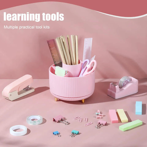 Pink Desk Accessories Set With Rotating Pen Holder, Stapler, Tape Dispenser, and Clips on a pink background