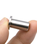 Grindmaster Crathco 3220 bearing sleeve; stainless steel cylindrical part with flange shown between fingers