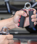 Hand Grip Strengthener Two Pack With Soft Foam Handles for wrist forearm and finger workout, close-up in use