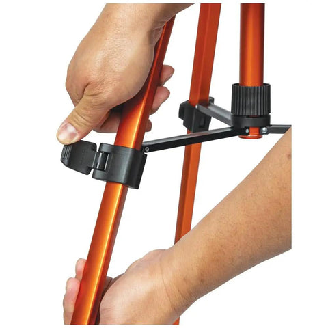 Hands adjusting height on Lightweight Aluminum Tripod With Mount For Laser Levels And Tools Flexible And Stable On Uneven Terrain