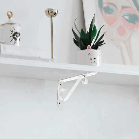 Heavy Duty Corner Shelf Brackets Wall Mount Supports Rock Solid Iron L Brackets Built Like A Tank For Diy Wood Shelving And Workshop Storage Super Sturdy Black Metal Braces Zero Stress Setup mounted on a white wall, showing support for shelves.