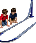 Children playing with a Flexible Dual Lane Race Track Set With U Turn Design For Kids 13 Feet Of Track Length DIY Curves.
