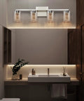 4 Light Brushed Nickel Crystal Vanity Light Fixtures With Dimmable LED Over Mirror glowing in modern bathroom