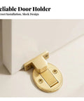 Reliable door holder in gold metal with discreet installation, part of a heavy duty floor door catch black design.