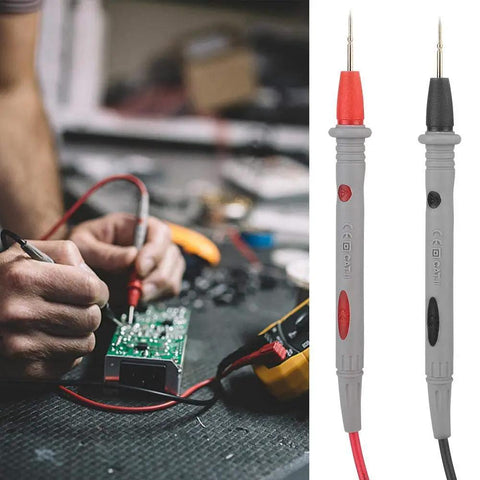 Beefed-Up 1000V 20A Multimeter Lead Kit With Comfort Grip Probes, red and black test leads in use on circuit board.