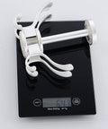 Straight Up Solid Wall Mounted Coat Rack With Five Rotating Metal Hooks on a scale, demonstrating 0.64 kg weight, premium gold and white design.
