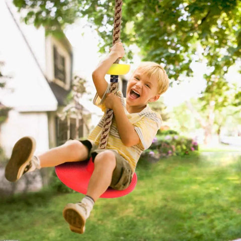 Child enjoying Climbing Rope Tree Swing With Platforms And Seat For Kids Kid-Friendly Outdoor Playground Accessories With Hanging Straps