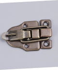 Close-up of a Vintage Wooden Box Hasps And Cabinet Toggle Latches Set 2 Pack Antique Brass Duckbilled Catch for wooden cabinets.